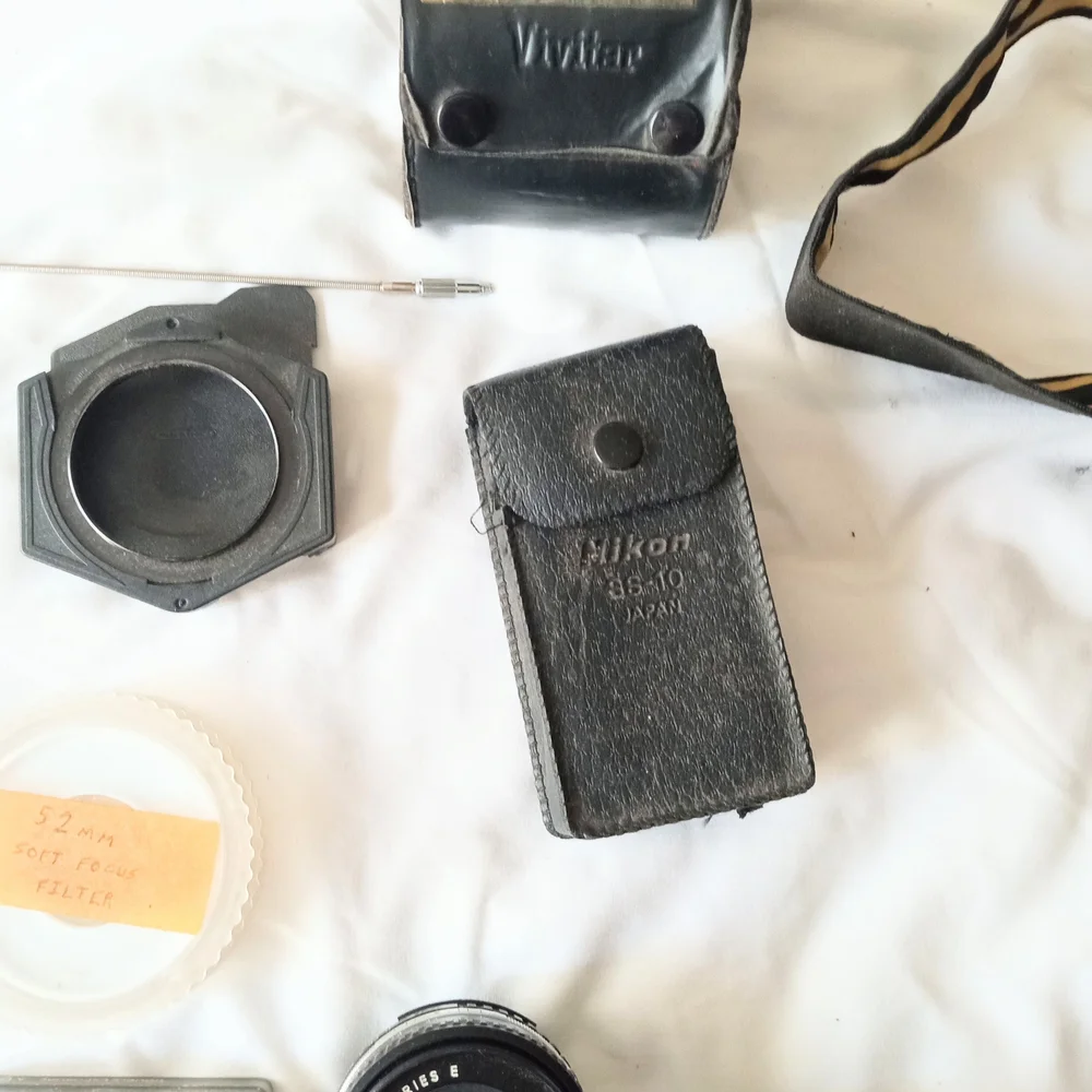 Nikon SLR Camera and Lens Kit with Tan Carry Bag and Black Body